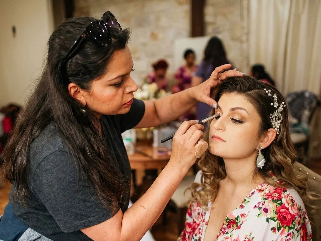 Asra applying makeup at a bridal event, Bridal Art Studio